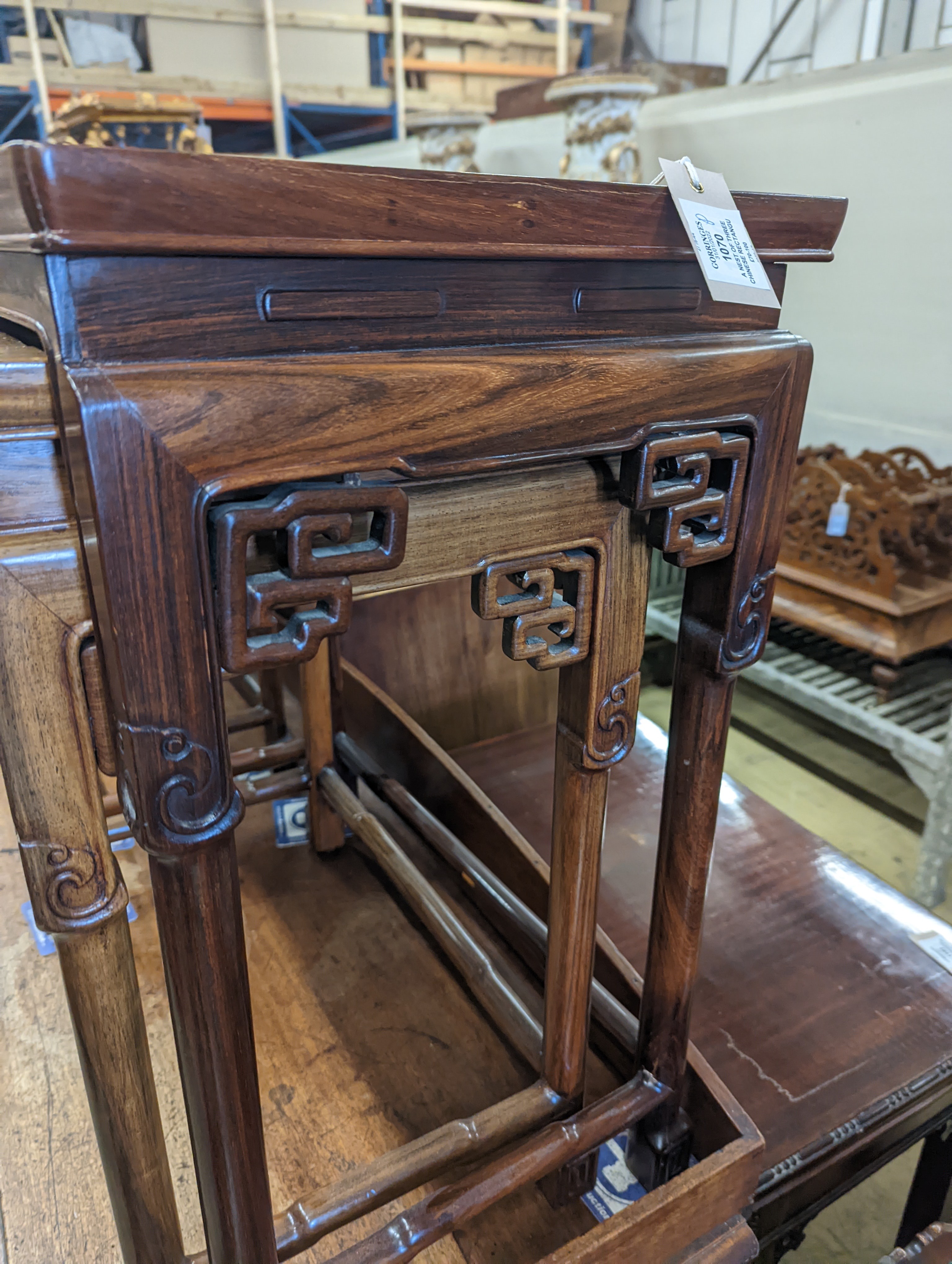 A nest of three Chinese rectangular tea tables, width 61cm, depth 36cm, height 66cm